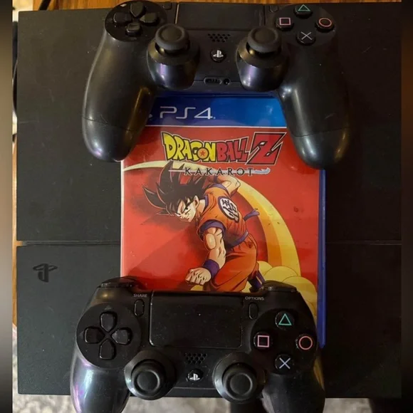 PlayStation 4 with two controllers and Dragonball Z Kakorat