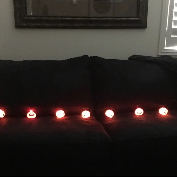 Halloween stein lights. Plastic 9’ long . 10 pumpkin lights on string.