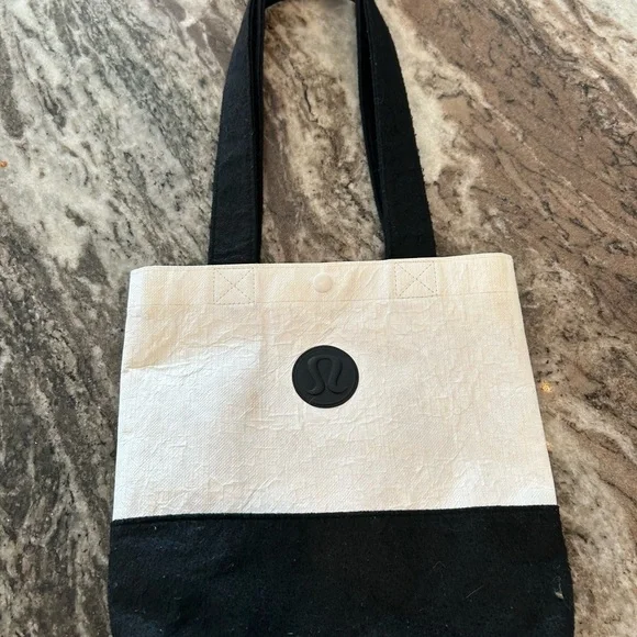 lululemon athletica Black and Cream Tote has wear stains piling