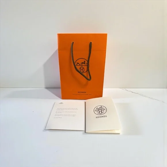 Hermès Vibrant Orange Bag with Elegant Cards