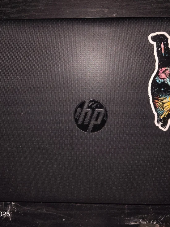 HP Black Laptop Lid with Colorful Sticker