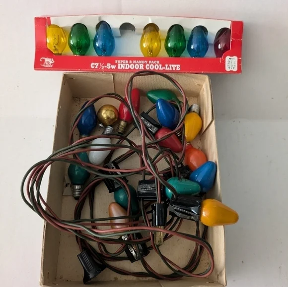 Vintage Christmas lights Multicolor and extra bulbs.