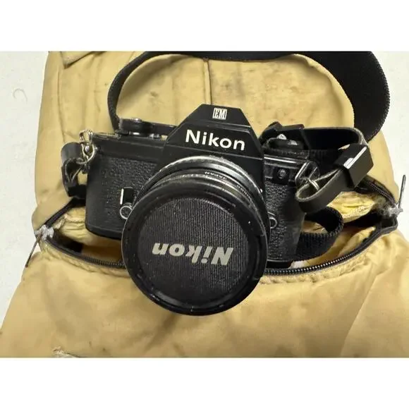 Nikon EM 35mm SLR Film Camera With 50mm Lens Plus 52mm Filter & Extra Lens & Bag