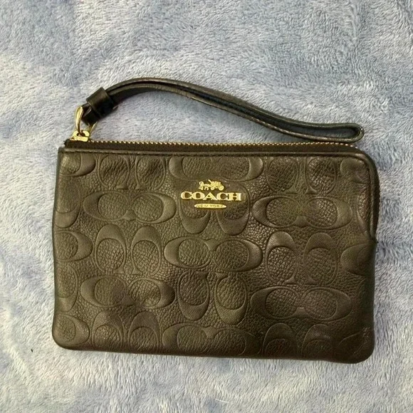Coach black wristlet with gold hardware‎
