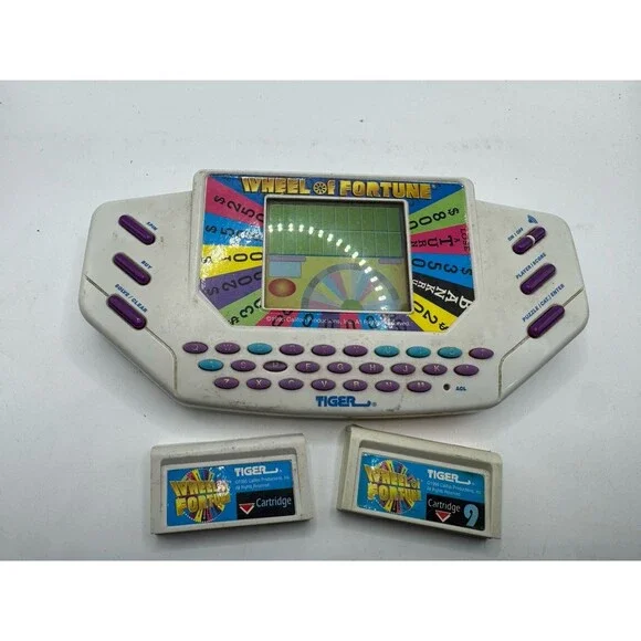 Tiger Electronics Wheel of Fortune Handheld Electronic game for parts or repair