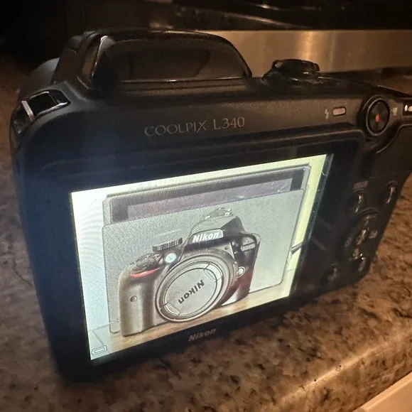 Great camera in great shape. 28x optical zoom wide lens. 20.2Mp point and shoot