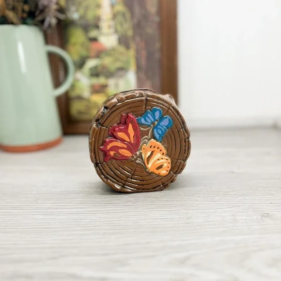 Vintage Ceramic Butterfly Piggy Bank: Kitschy Wood Log Decor