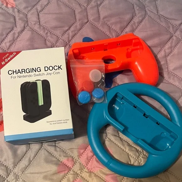 #49 - Nintendo Joy-Con Charging Dock with Red and Blue Steering Wheels