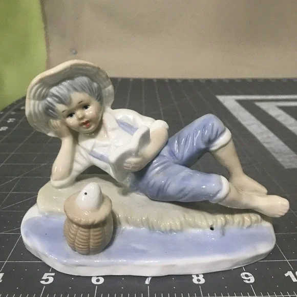 Vintage Porcelain Blue and White Boy Fish Figurine Propped Elbow‎ Reading