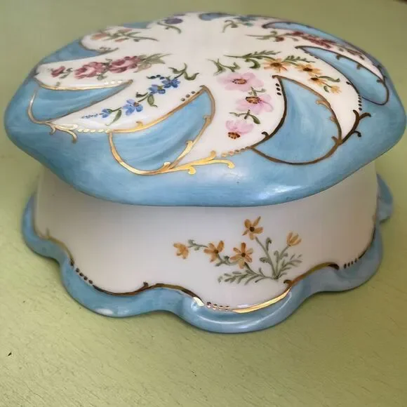 Vintage hand painted porcelain trinket box by Jeanette Wriedt .