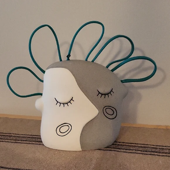 Abstract Face Aquarium Decor with Teal Accents