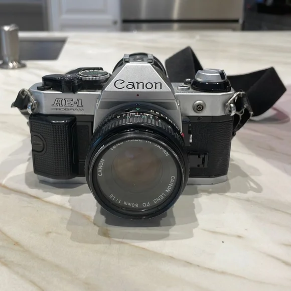 Canon AE-1 35 mm SLR camera with flash