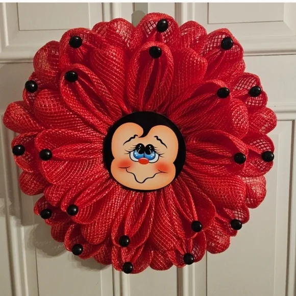 Red Decorative Floral Wreath with Smiling Face Center