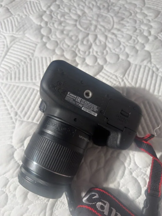 Canon Black DSLR Camera with Zoom Lens and Red-Trim Strap