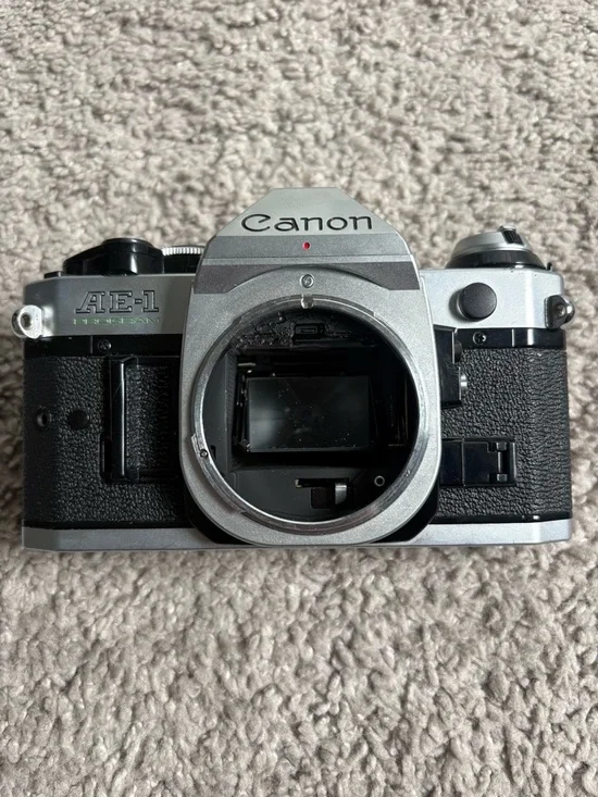 Canon JAPAN AE-1 35mm SLR Film Camera + Sakar Zoom Lens Bundle – Untested
