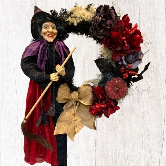 Hand crafted spooky season witch wreath with red and purple floral