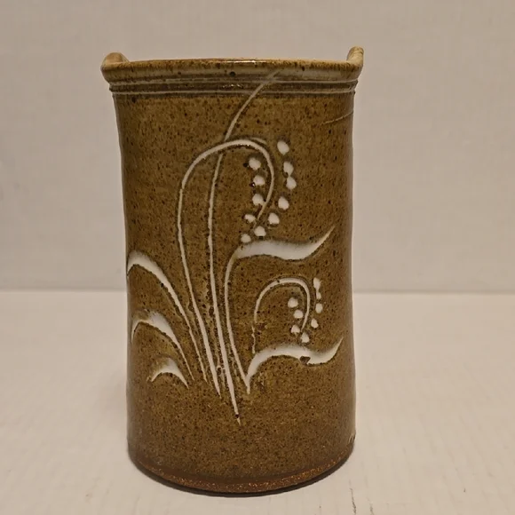 Brown Signed Pottery Vase with White Floral Design