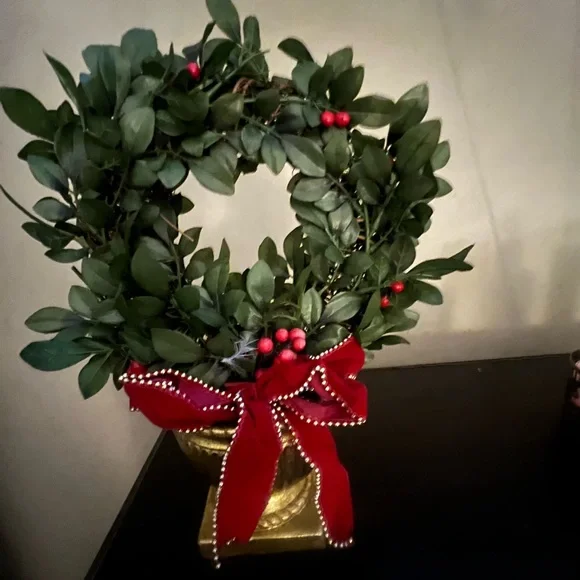 Green Boxwood Wreath with Red Velvet Bow on gold holder