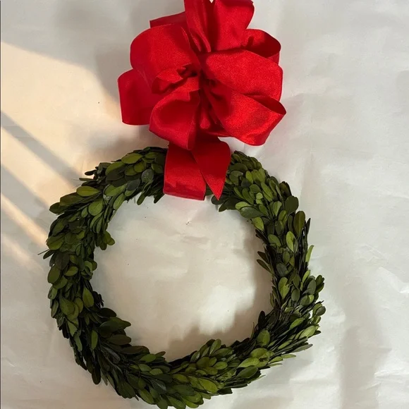Festive Green Wreath with Red Bow made from Dried Boxwood.