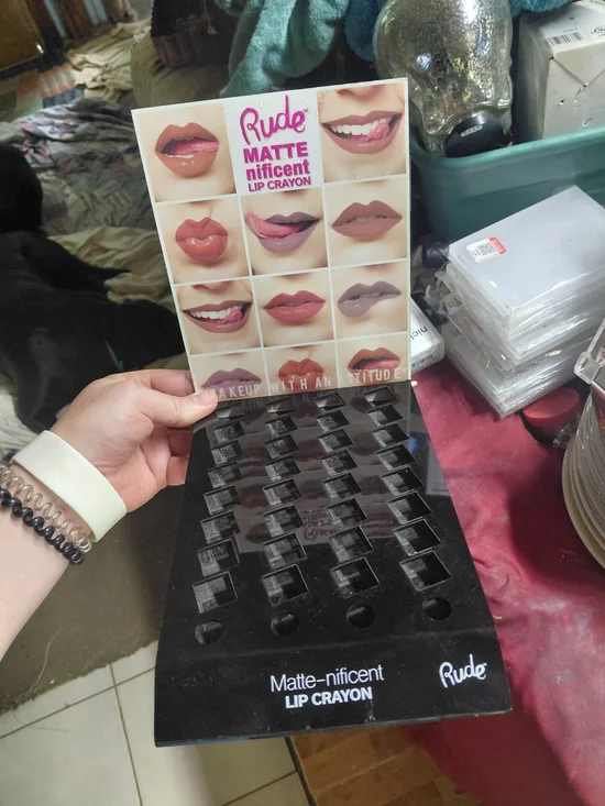 Rude Cosmetics display holds Matte-nificent Lip Crayons