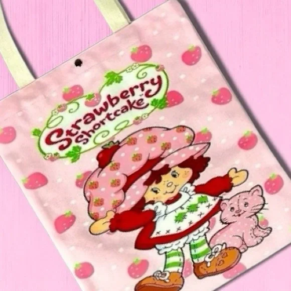 Strawberry Shortcake and her puppy, Pupcake adorable and adorable tote bag