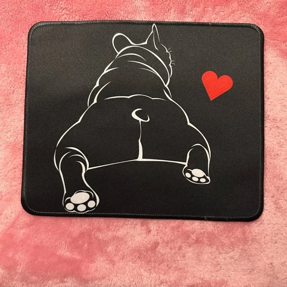 Black mouse pad featuring French bulldog with a red heart. New
