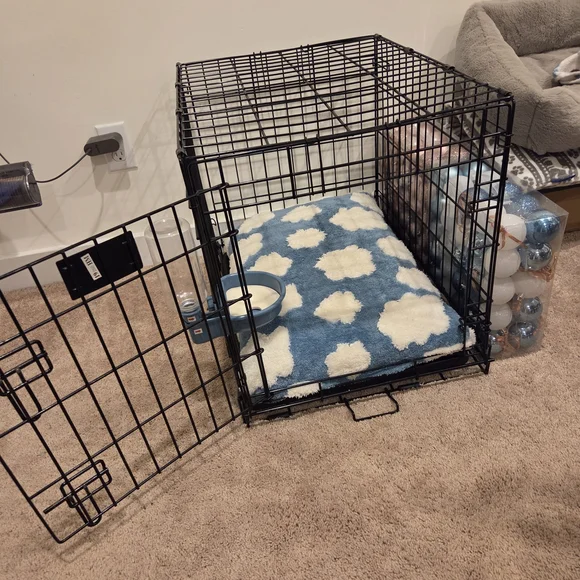 Black Wire Pet Cage with Blue and White Cushion