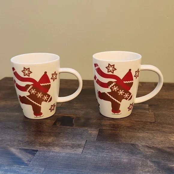 Set of ice skating gingerbread man mugs Crate & Barrel