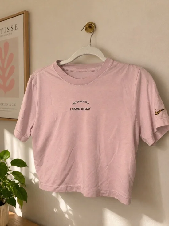 Nike Light Pink Cropped Tee with printed Swoosh