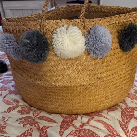Handcrafted Basket with Pom Pom Accents