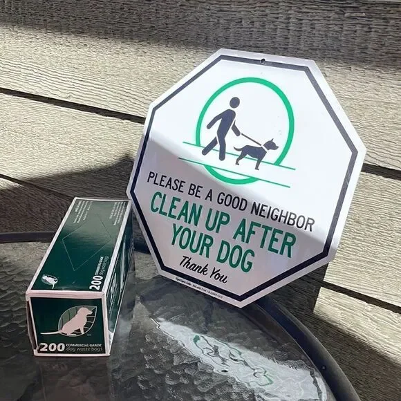 Dog waste bag and sign. Please be a good neighbor, clean up after your dog. New