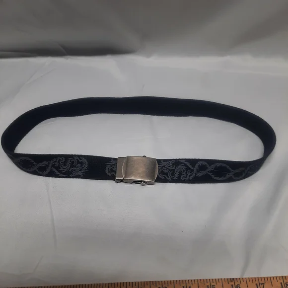 Reversible black belt, side 1 is black w/ grey dragons & side 2 is solid Black