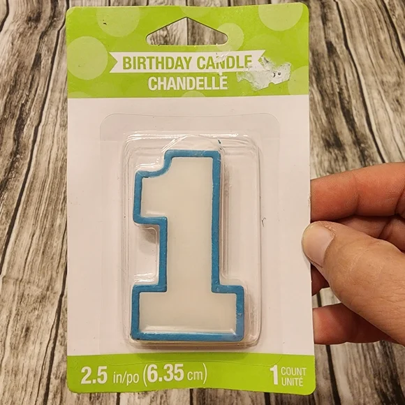 Blue Number 1 birthday cake candle. Measures 2.5 inches tall.