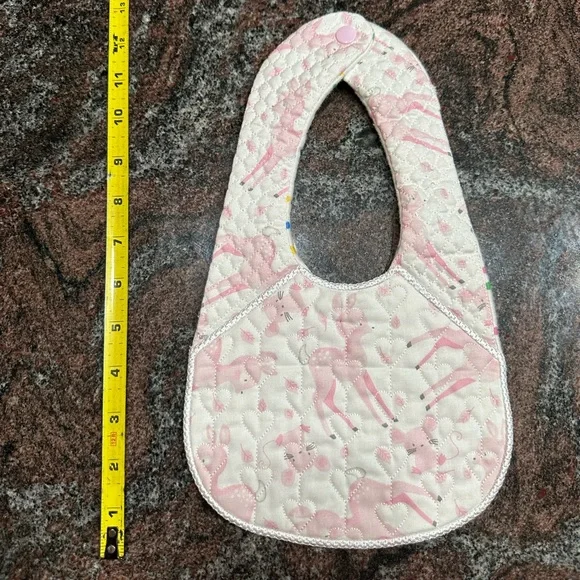 Handmade reversible quilted baby bib in pink deer print