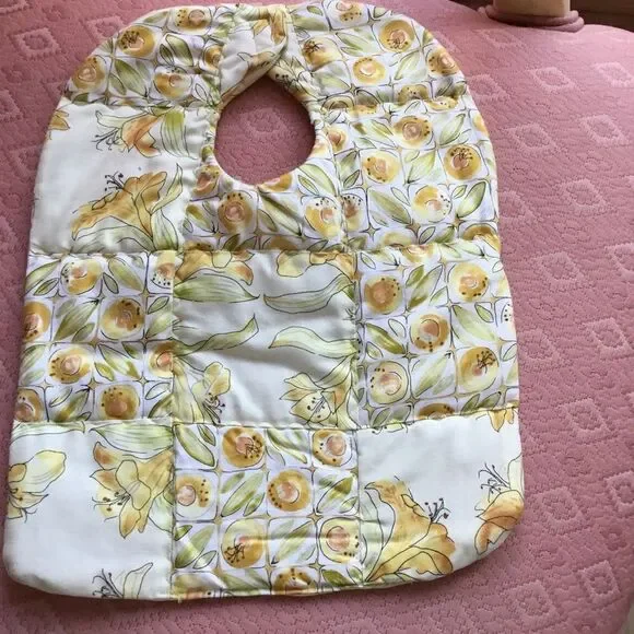 3/$25 or $12 each. NWT Yellow and Green Floral Print Reversible Bib