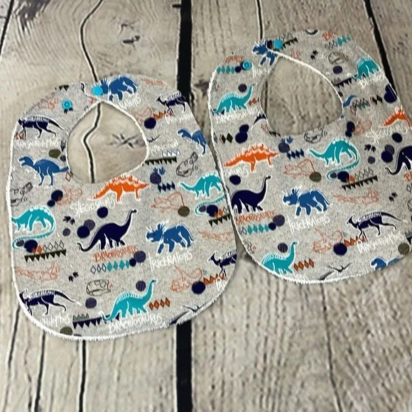 Designer handcrafted dinosaur bib