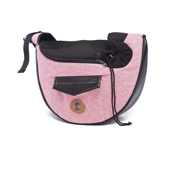 Pet carrier bag strap has a cell phone holder. The strap is padded like new.