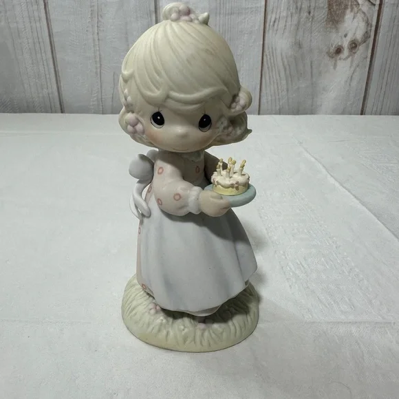 Precious Moment’s figurine titled “May Your Birthday Be A Blessing” from 1990