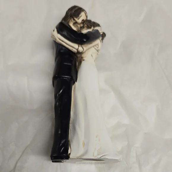 Elegant Black and White Embracing Couple Figurine