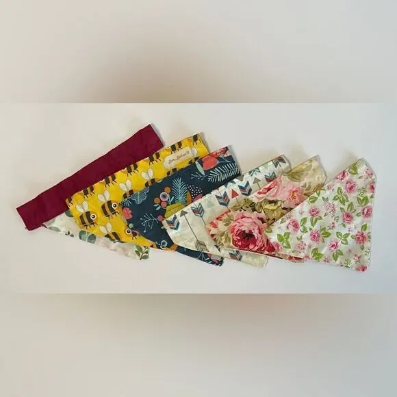 Good used condition. 6 dog bandanas with slit for collar for small dogs.