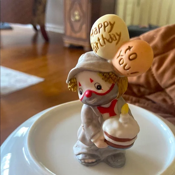 Enesco Red and Orange Clown that has balloons that have Happy Birthday To You.