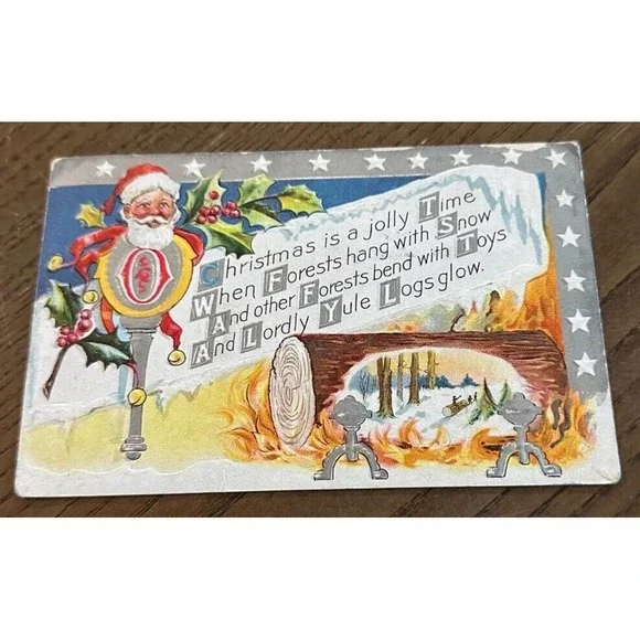 1911‎ Antique Embossed M.L. Jackson Christmas Santa Log Fire Postcard USED