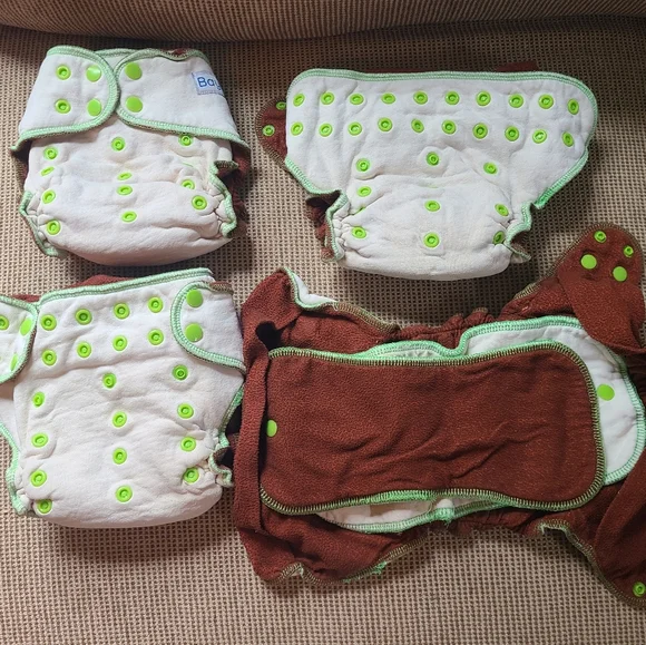 FOUR BAYRLI HEAVY WETTER CLOTH DIAPERS AND COVERS