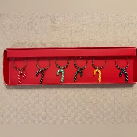 Pier 1 Imports multicolored glass candy cane drink charms in original box.