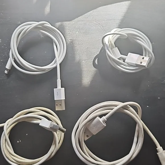 Bundle of white USB to Apple Lightning Charging Cables