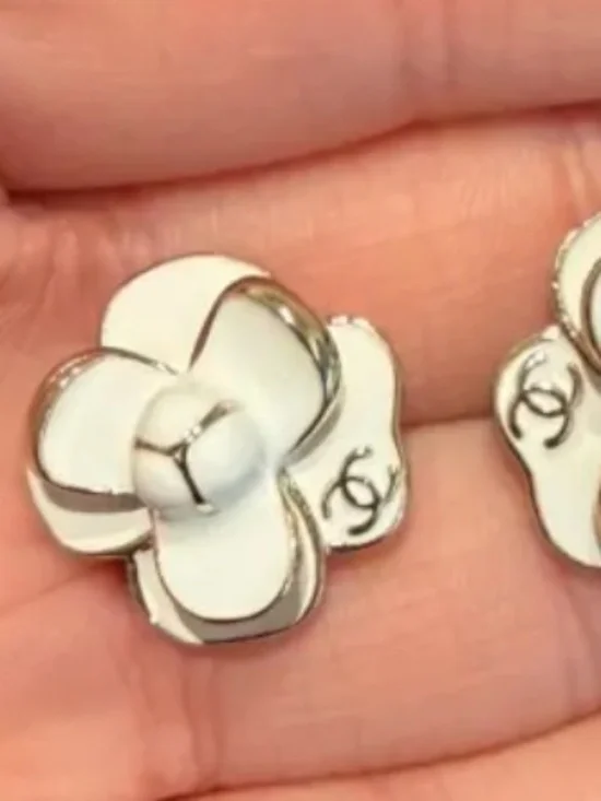 Chanel White and gold tone camelia flower stud earrings