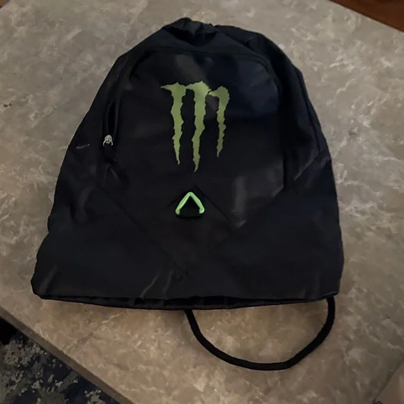 Black Backpack with Green Logo