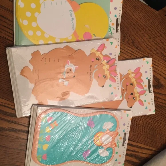 4 unopened pkgs of 10 each baby shower invitations. From the Thought Factory.