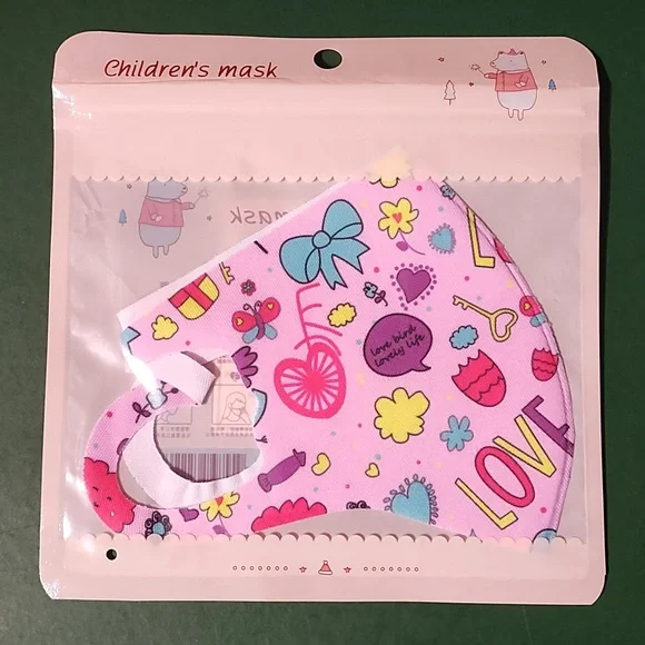 Children's re Usable face mask new in package never opened