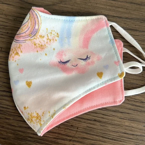 Pink lined white and blue unicorn clouds outer face mask